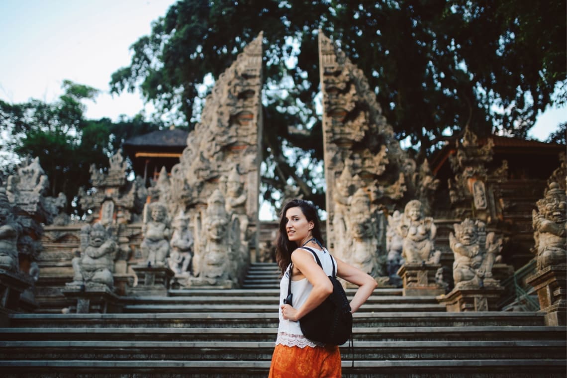 Girl in front of a temple entrance in Bali