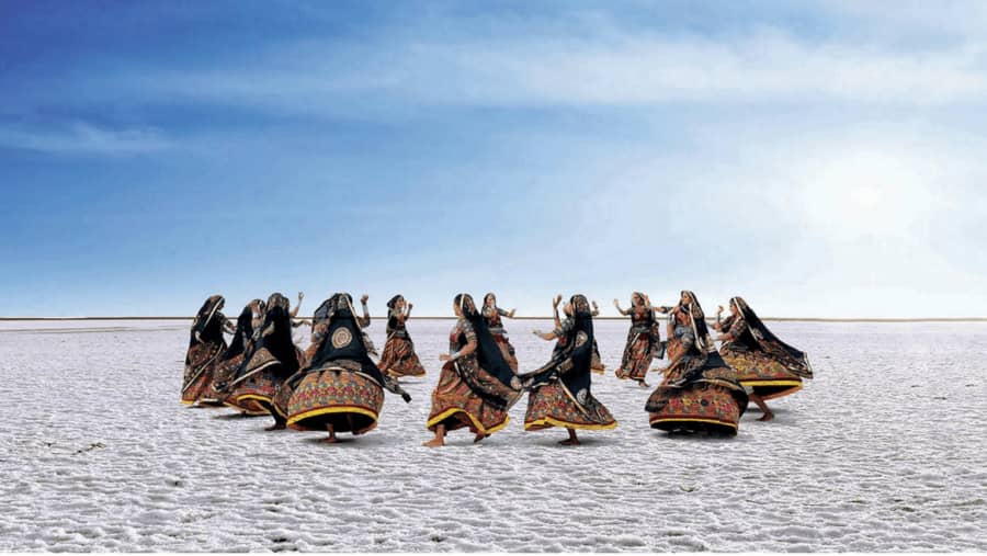 Folk dancers on the white salt desert of the Rann of Kutch
