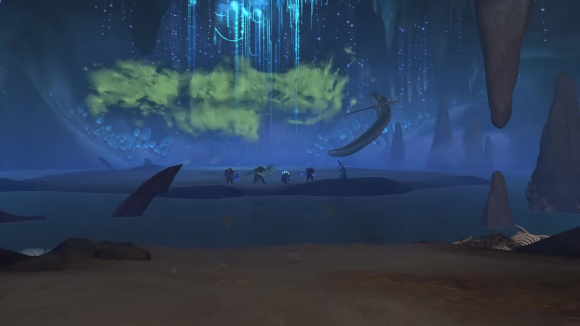 A raid group faces a huge serpent inside The Venomous Abyss.