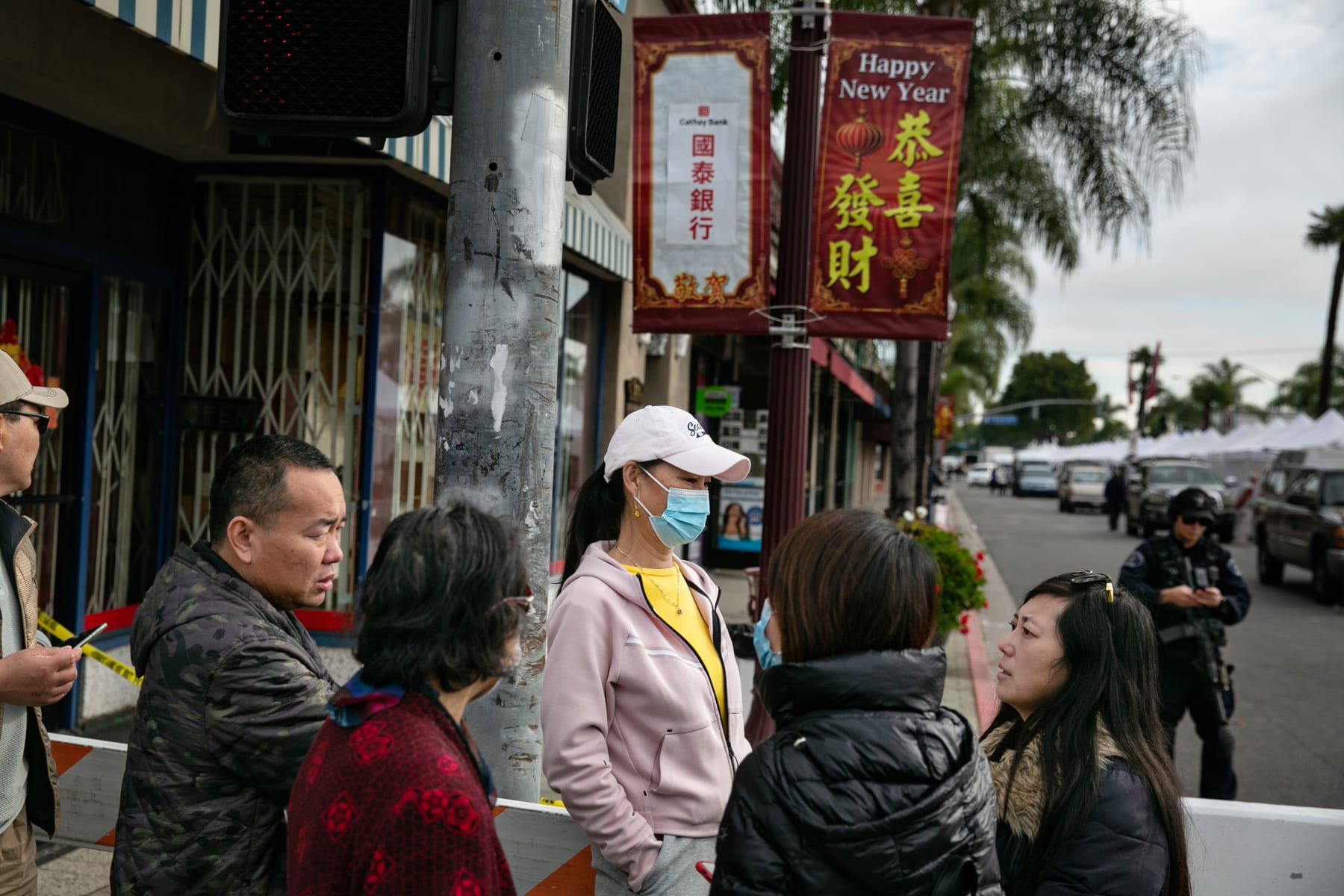 Dong interviewing onlookers after a gunman opened fire at a ballroom dance studio in Monterey Park, CA, 2023. (Jason Armond / Los Angeles Times via Getty Images)