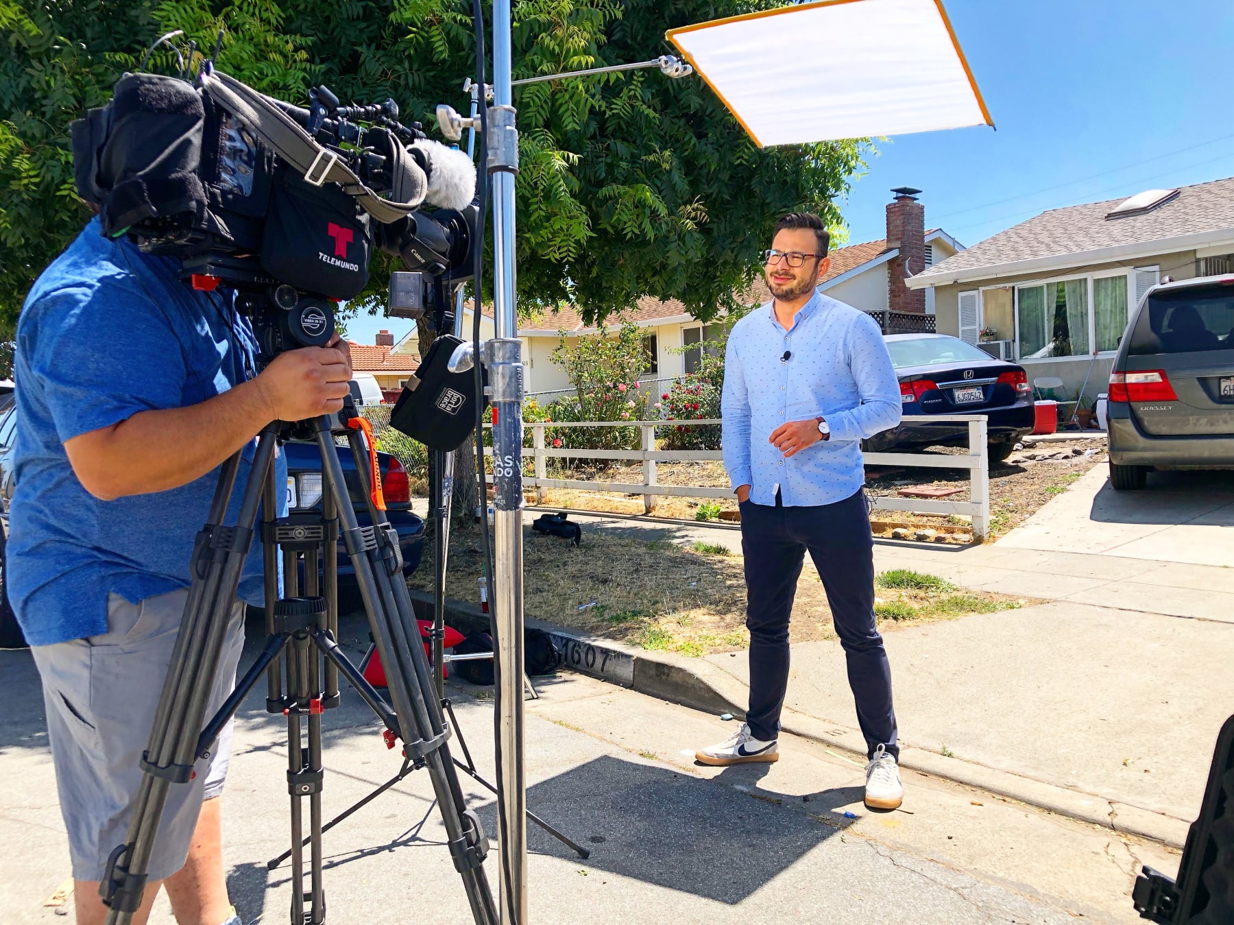 Guad Venegas films a standup before a cameraman.