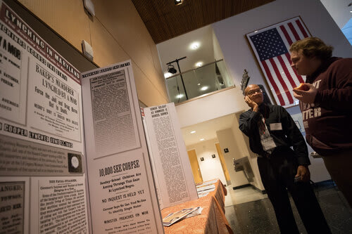 Christopher Providence and Seamus Benn, left and right, both activists for racial justice, chat during the Maryland Lynching Memorial Project's inaugural conference at the Reginald F. Lewis Museum of Maryland African American History & Culture, which covered the history of lynching in Maryland and reconciliation in Baltimore, Md.