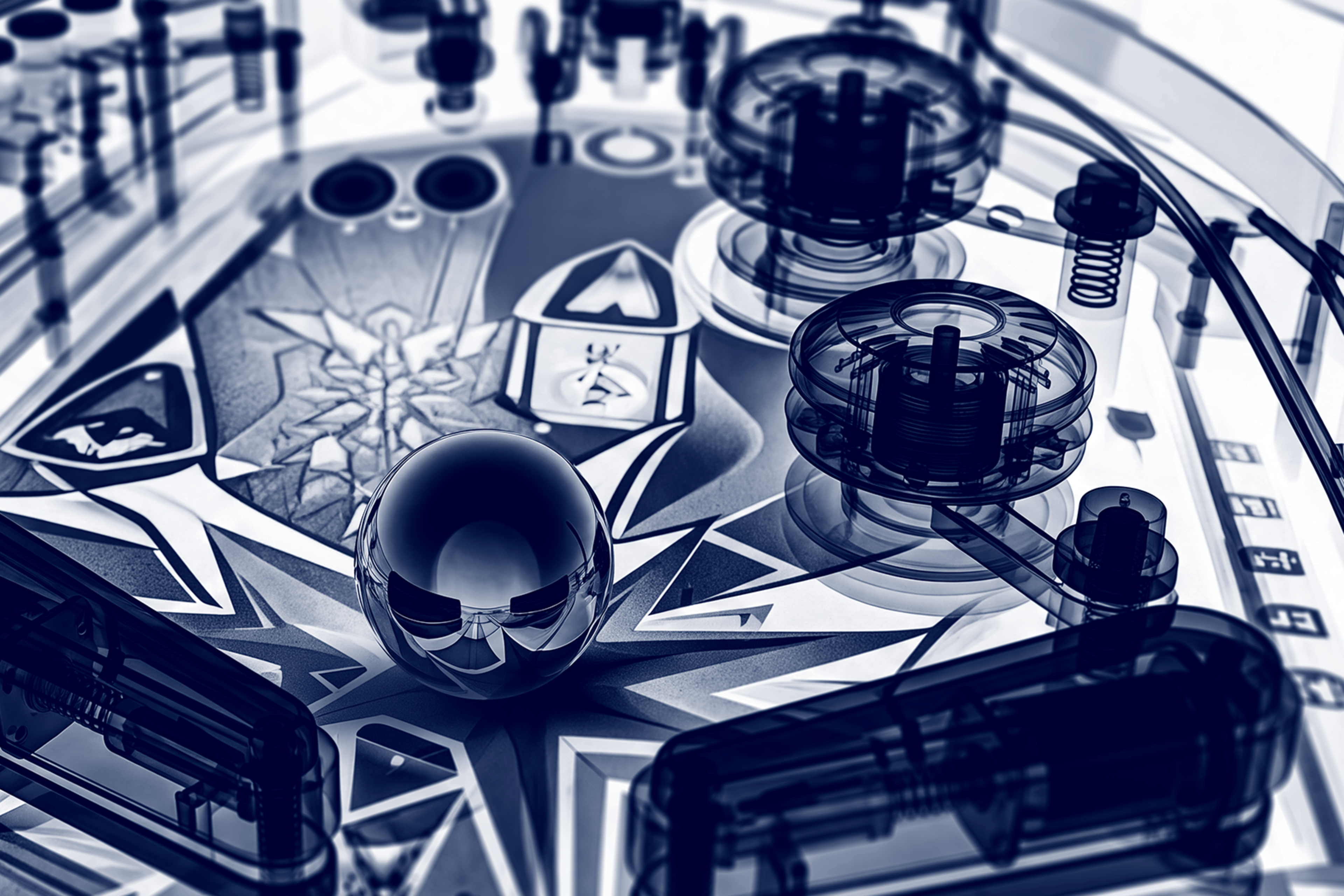 A close-up, blue-toned X-ray style image of a pinball machine playfield, featuring a reflective metallic pinball surrounded by transparent flippers, bumpers, and visible internal mechanical components.
