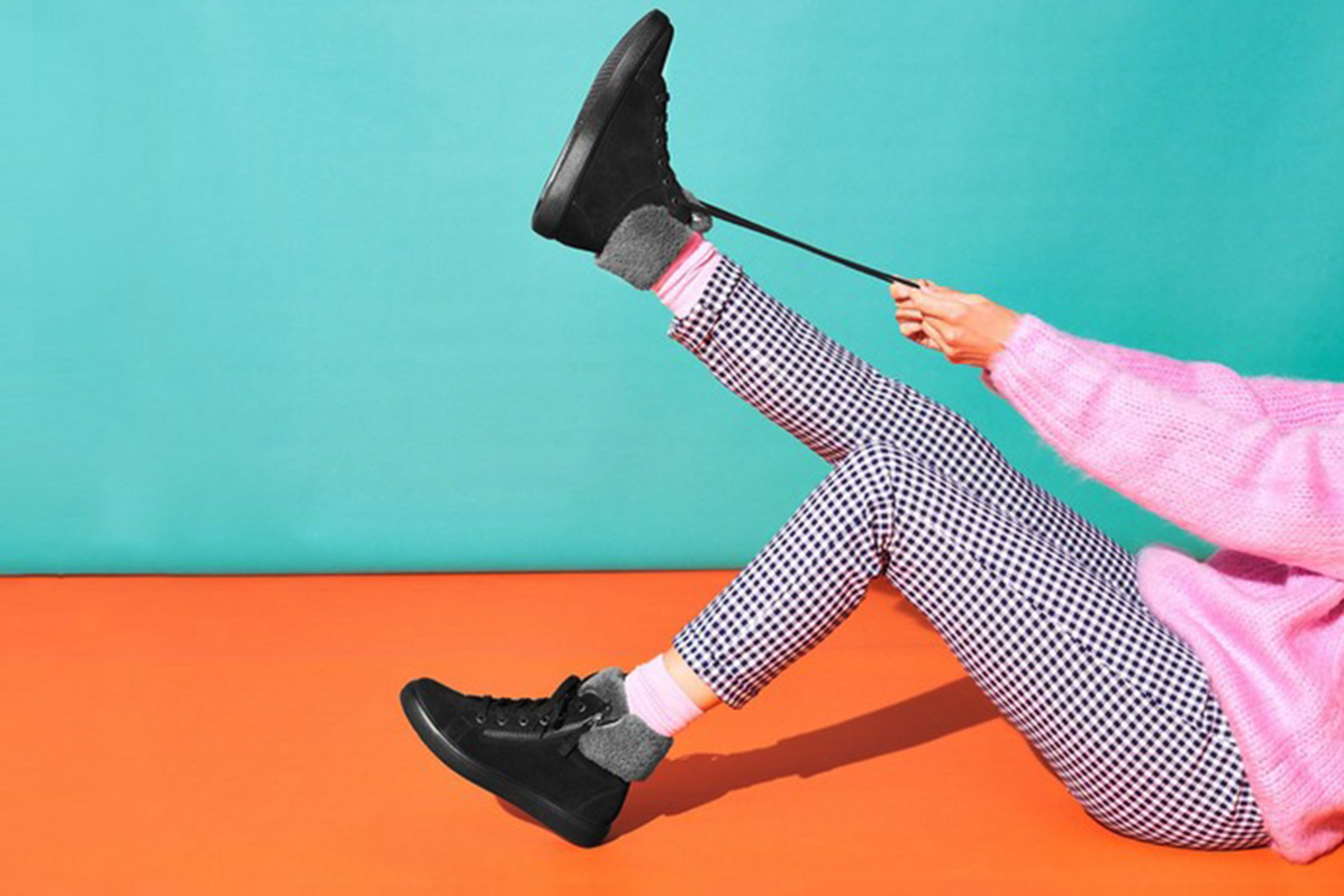 Hotter Shoes' brightly coloured image with person tying their laces