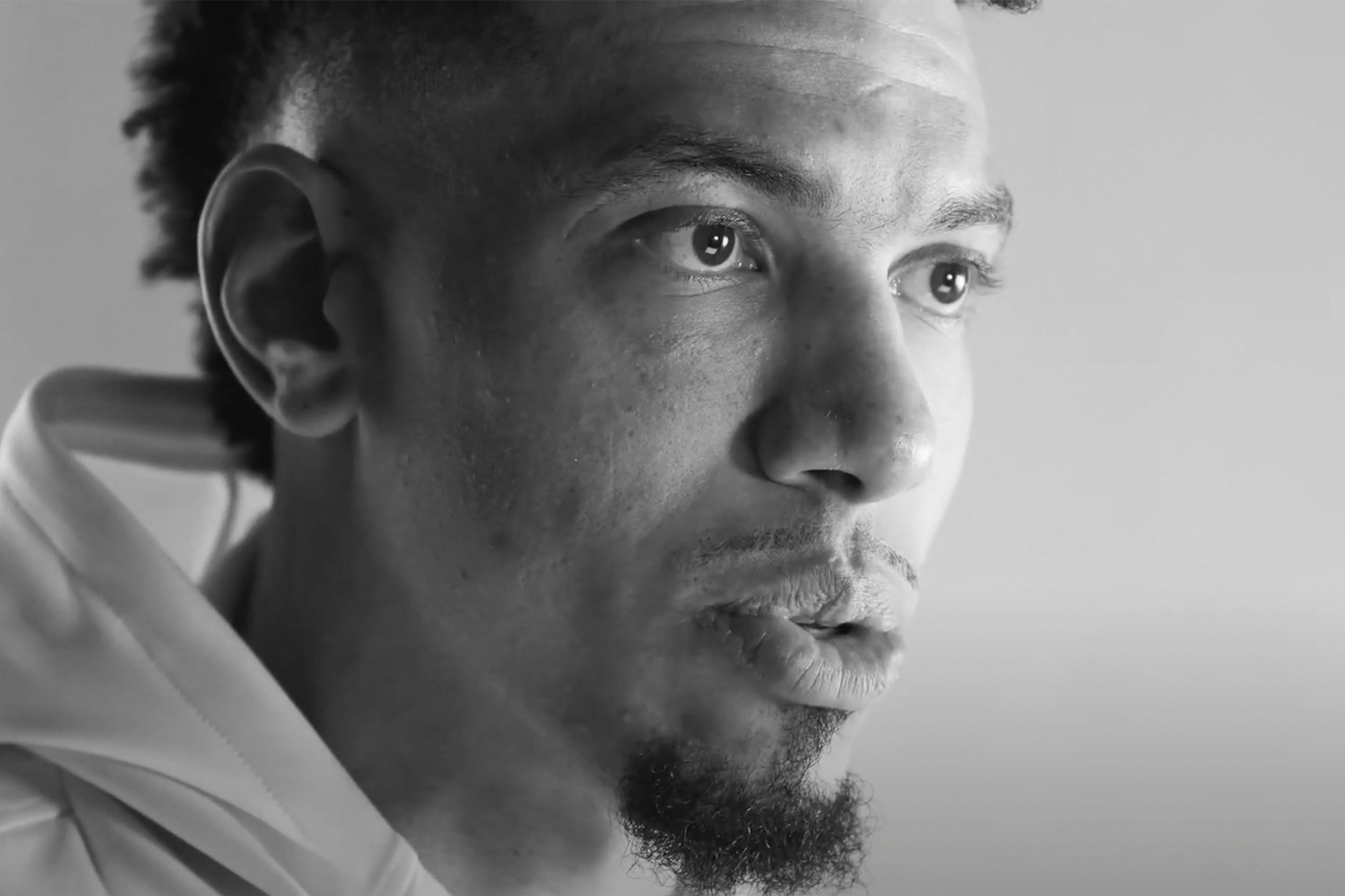 Black & white close up image of a man