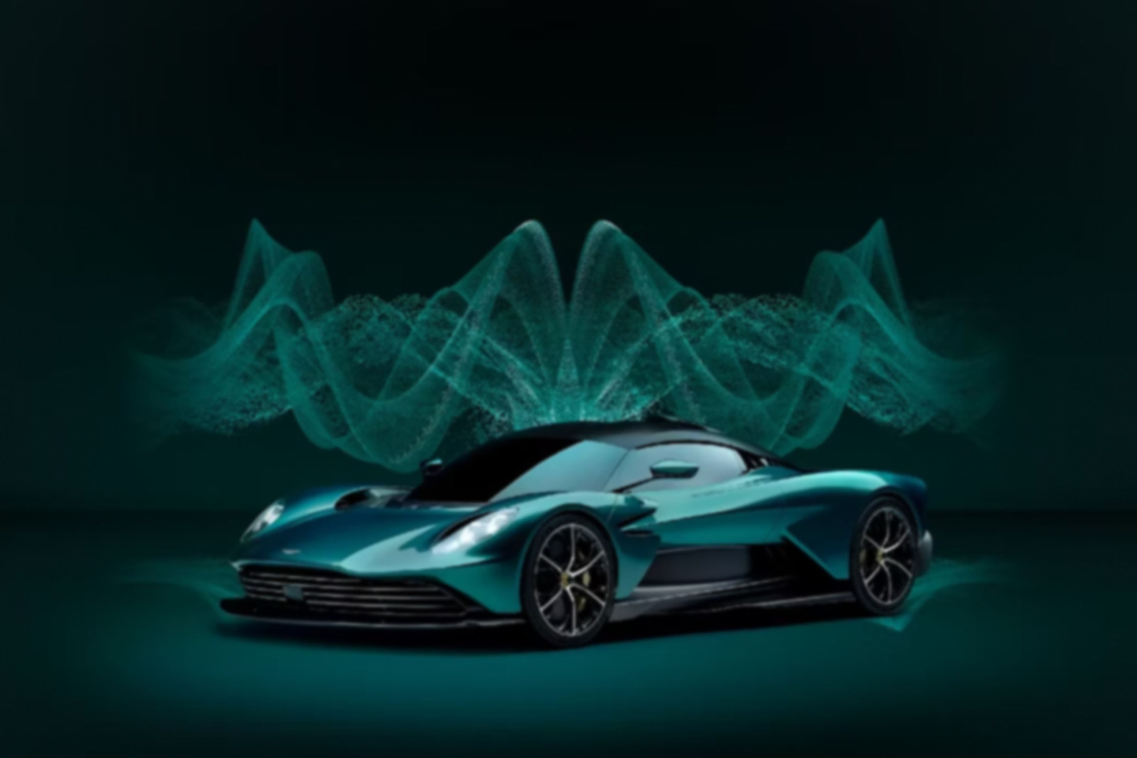 Green Aston Martin Valkyirie car on a green background with glowing green and pulsating visualisations in the background