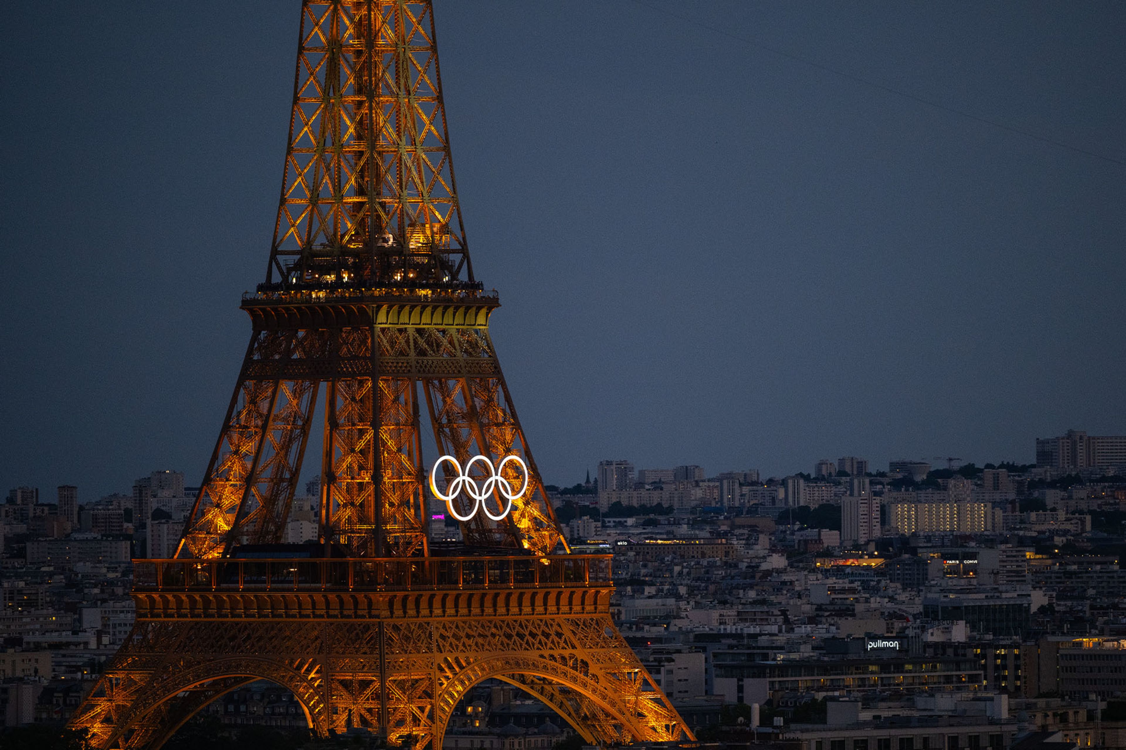 Eiffel tower at night with Olympic rings