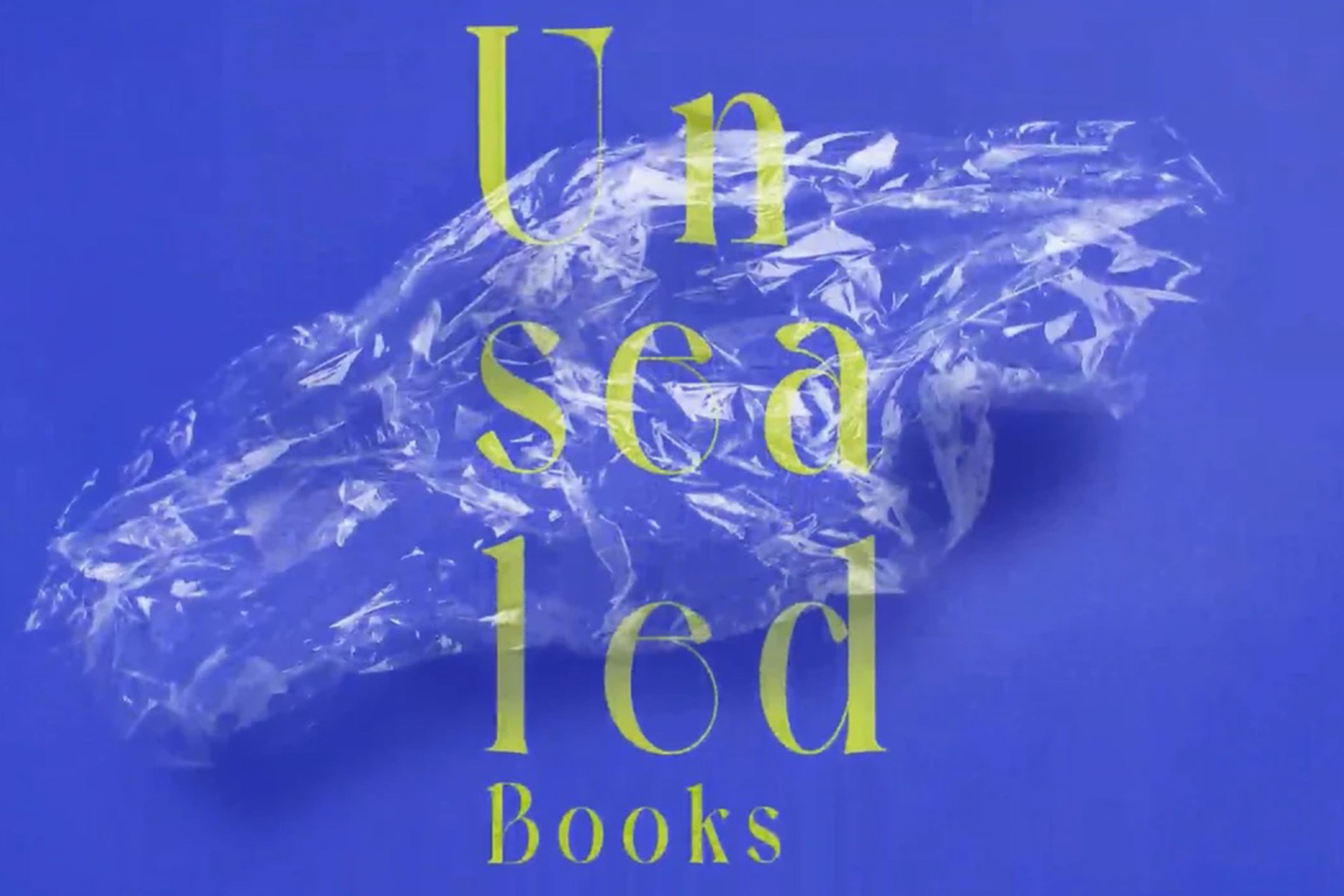 Yellow text reading "Unsealed books" with a scrunched up bit of plastic on a blue background