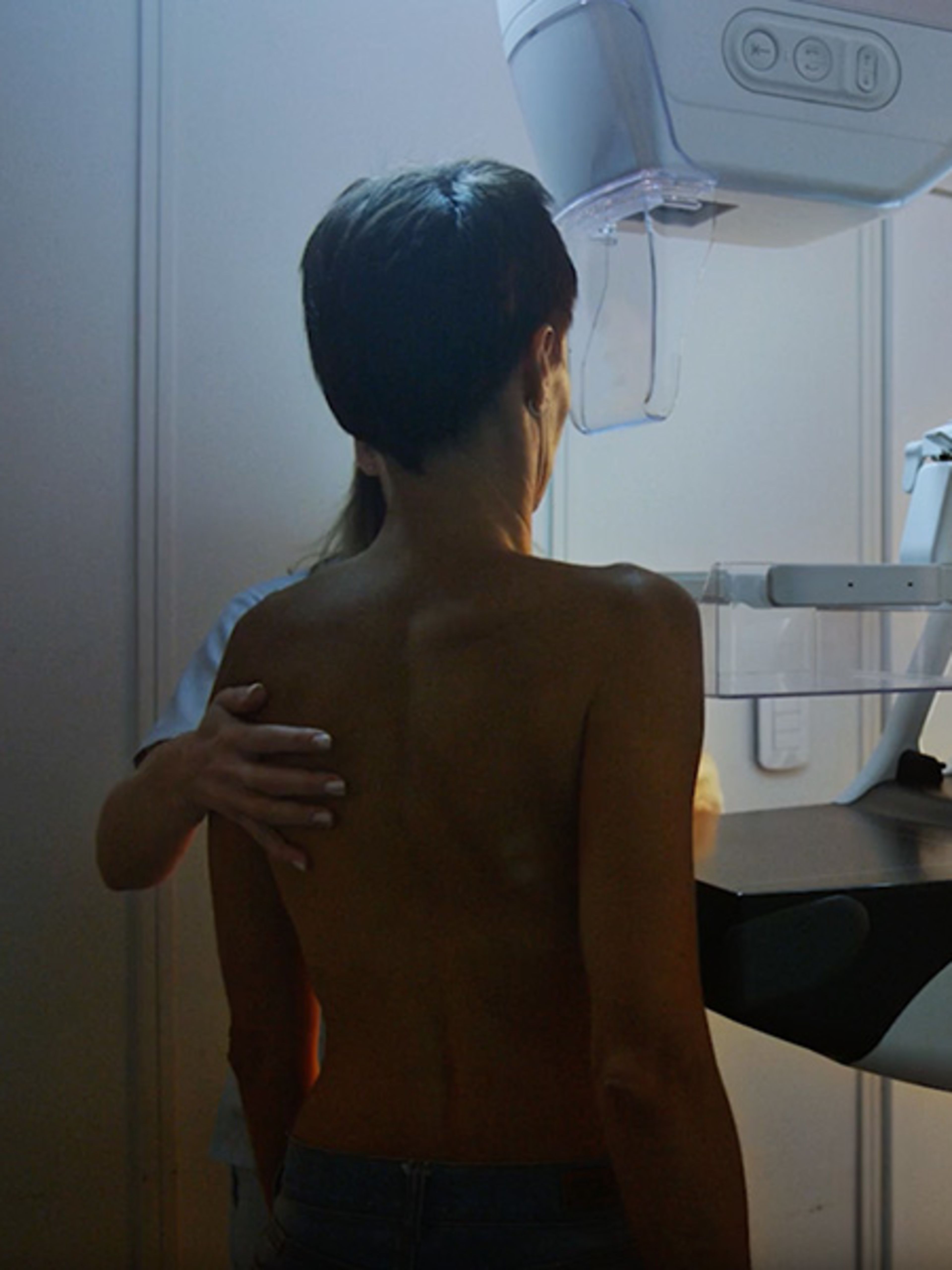Female getting a mammogram with a nurse