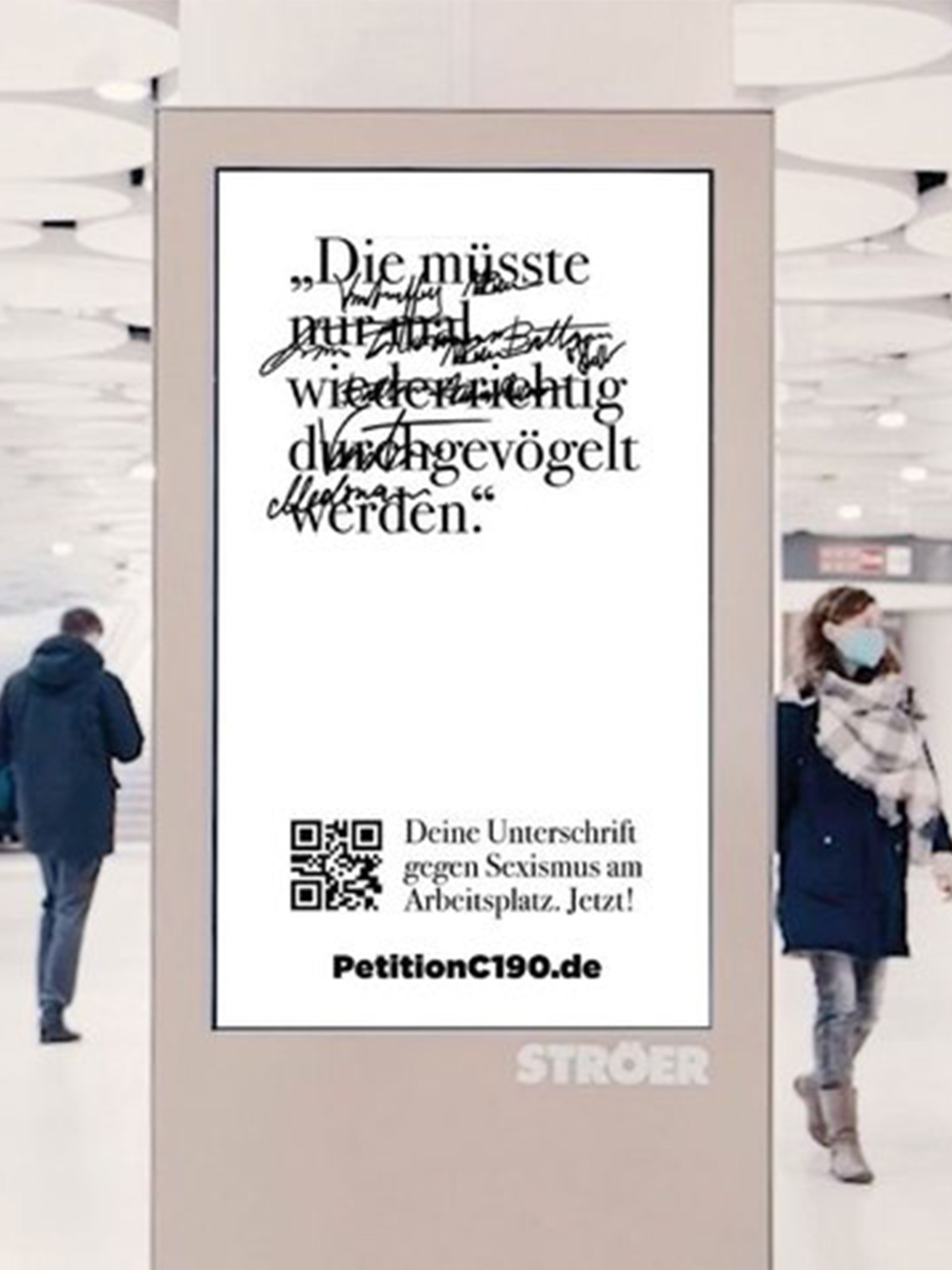 Digital billboard with people walking around in a light and bright mall space