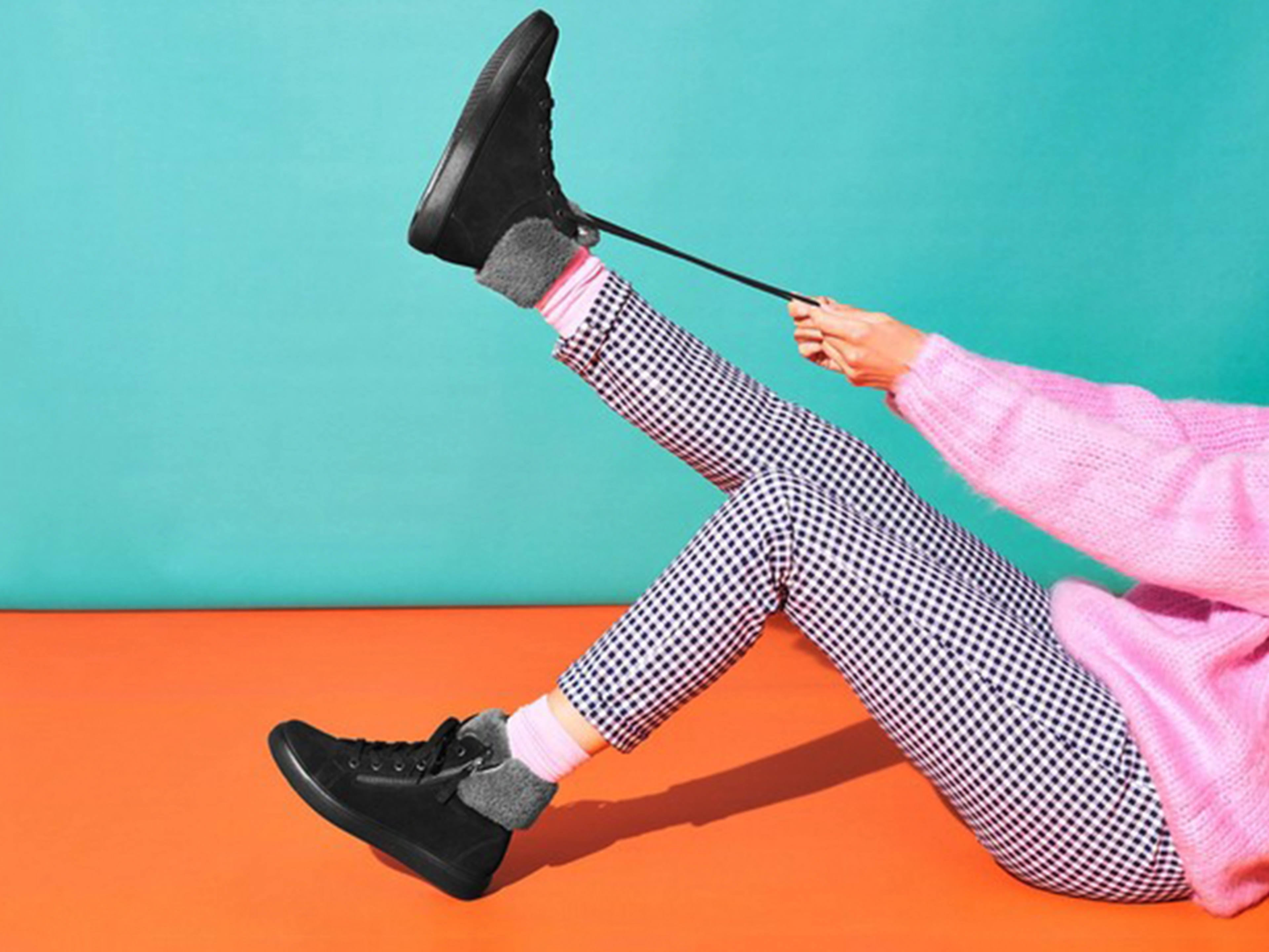 Hotter Shoes' brightly coloured image with person tying their laces