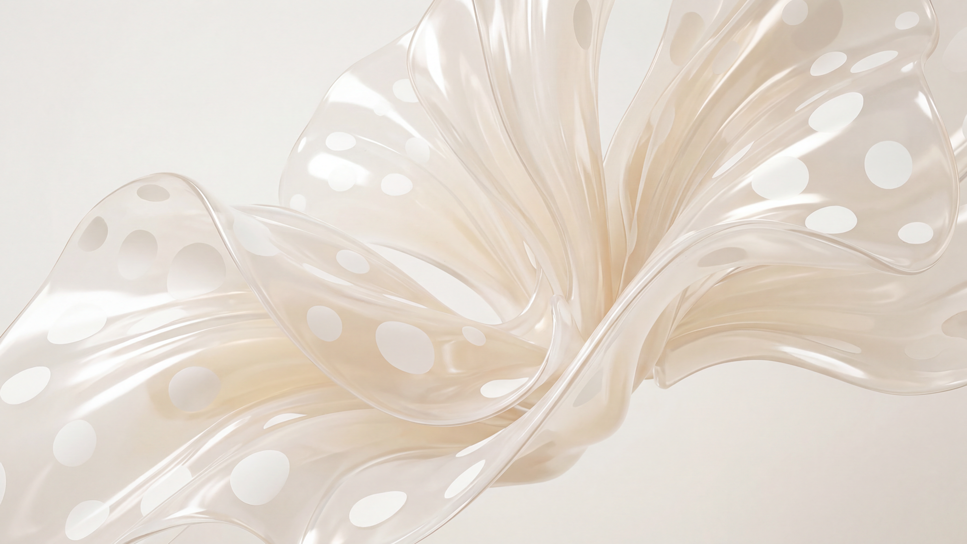 Flowing cream silk with white polka dots in graceful waves against light background