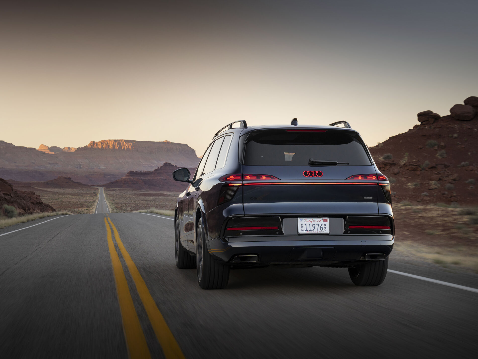 Audi Q9 dynamic rear three quarter view