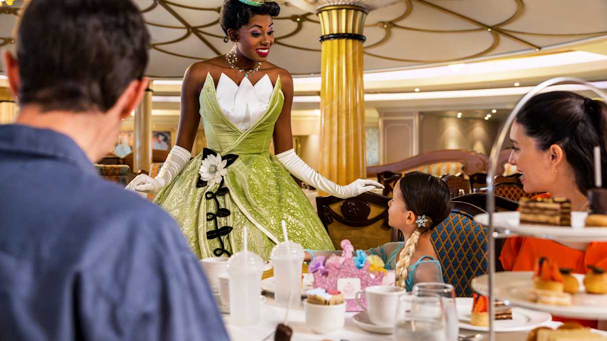 Princess Tiana with guests on Disney ship at Royal tea