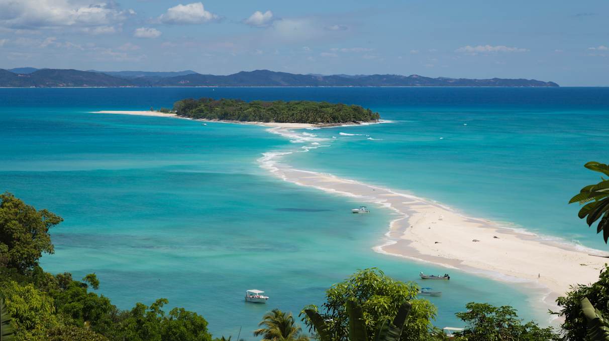 Turquoise blue water on a tropical island beach in Nosy Be Madagascar, Africa.