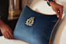 Cunard cushion on bed