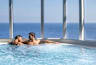 A couple relaxing in a hot tub on a MSC Cruise ship