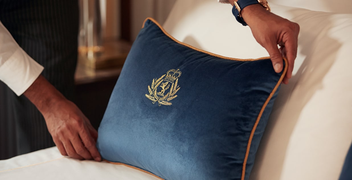 Cunard cushion on bed