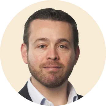 professional man with beard in circular frame, business portrait with neutral background