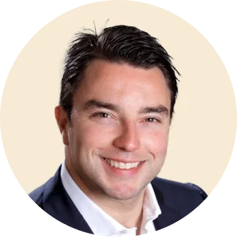 smiling man in professional attire against soft background, portrait of confident businessman with short dark hair