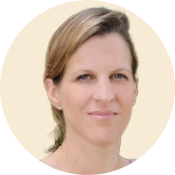 portrait of a woman with light brown hair and a neutral expression against a pale background, female professional headshot