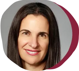 portrait of a woman with long dark hair and a friendly smile, professional headshot with a soft background and rounded edges