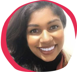 smiling woman with long dark hair and bright white teeth, circular crop with pink background highlights her face