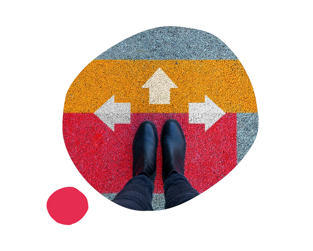 footwear on colorful pavement with directional arrows indicating multiple route options, vibrant ground markings for guidance
