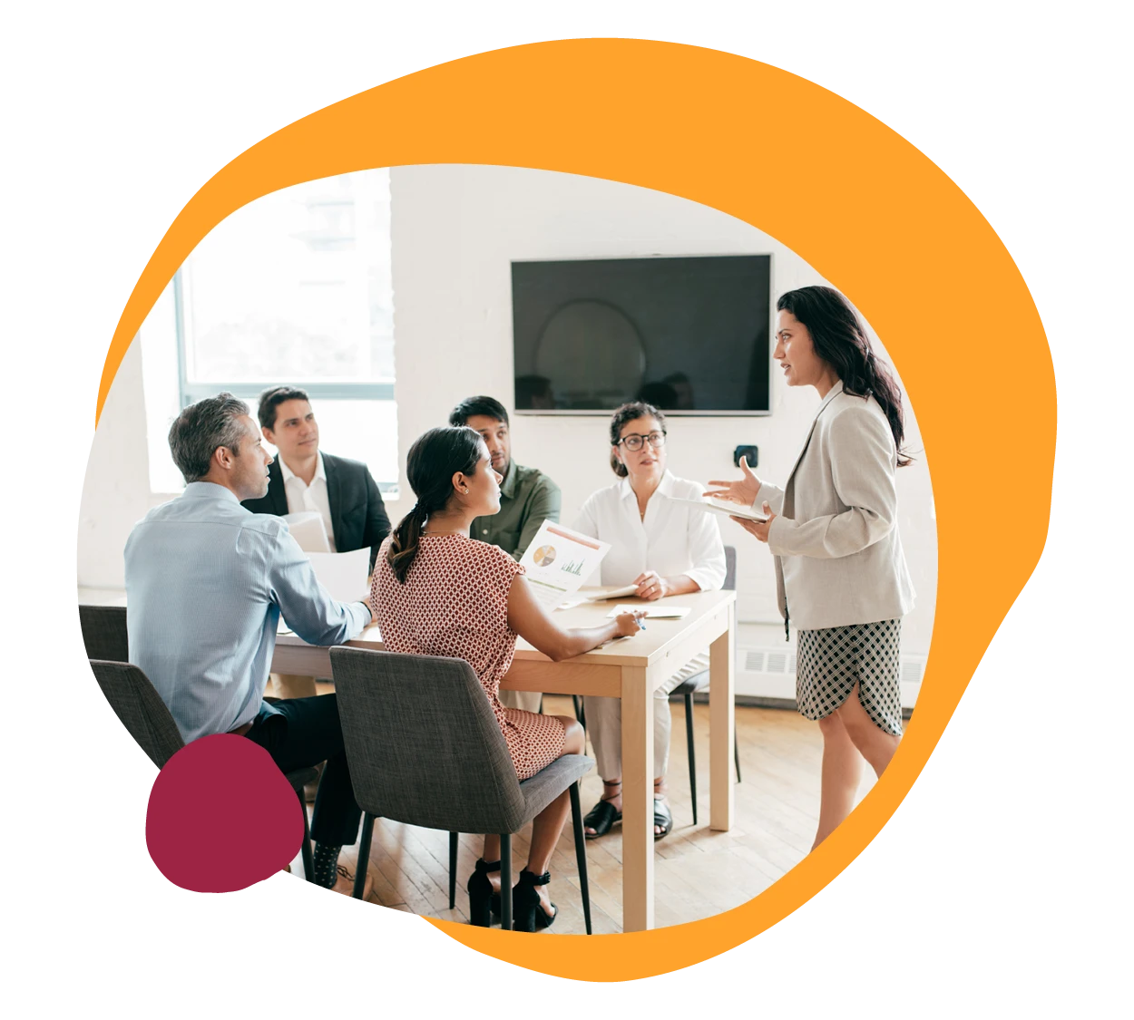 business meeting, female presenter, diverse audience