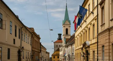historic-street-view, colorful-buildings-and-flags