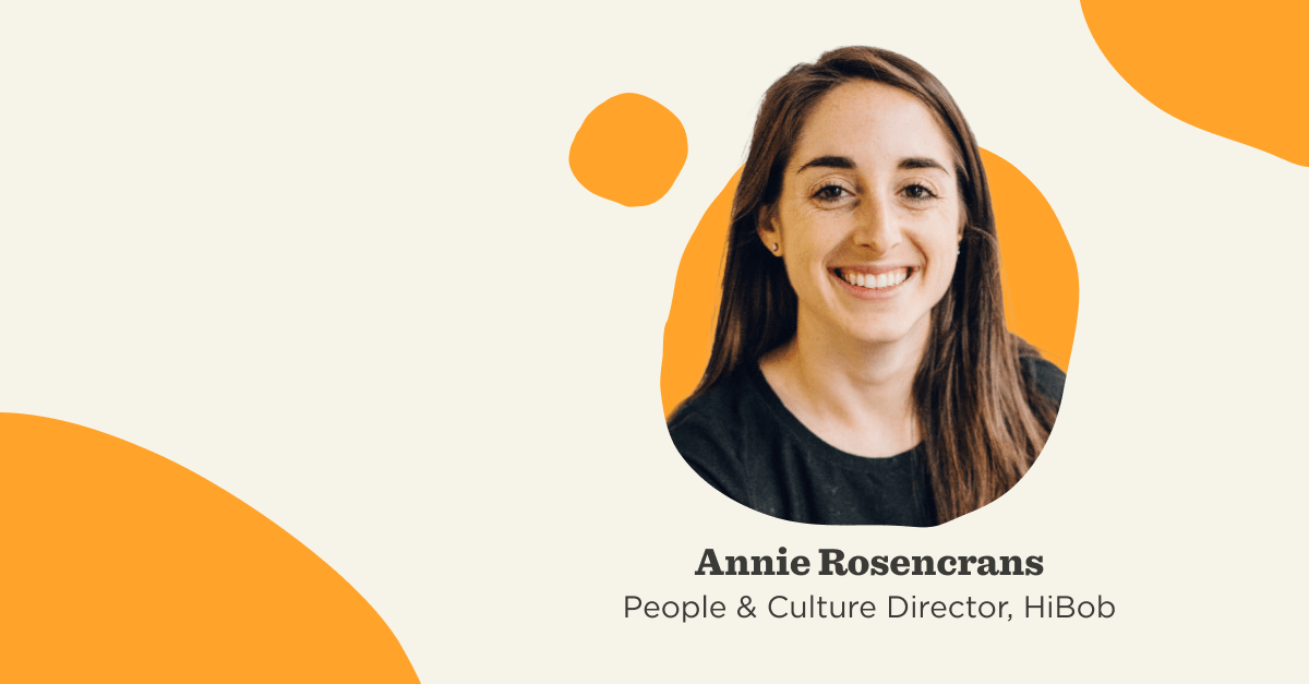Annie Rosengrans, People & Culture Director at HiBob, smiling against a soft, abstract background with orange accents., AnnieRosengrans, PeopleCultureDirector