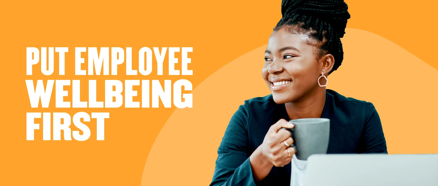 employee wellbeing, smiling professional woman holding a coffee cup in a modern workspace with bright orange background