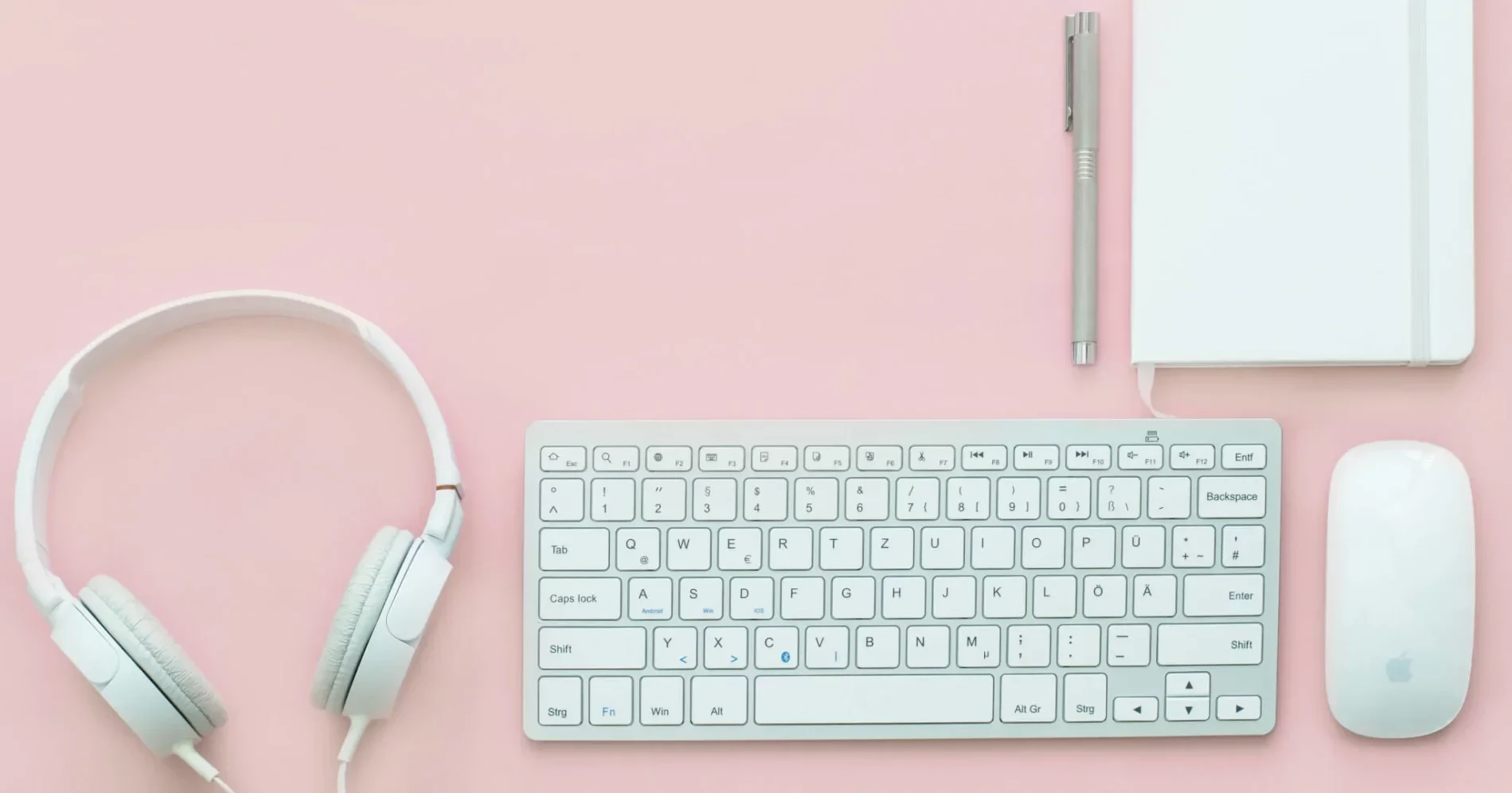 keyboard, headphones, notebook, pen