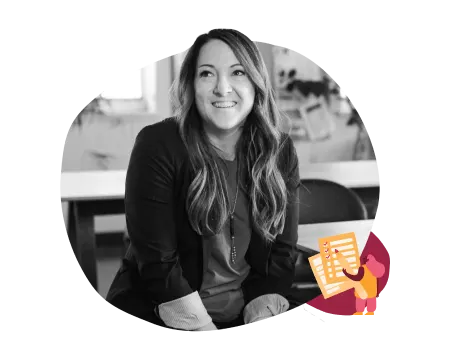 professional woman smiling in a classroom setting, engaging educator with creative visuals and materials