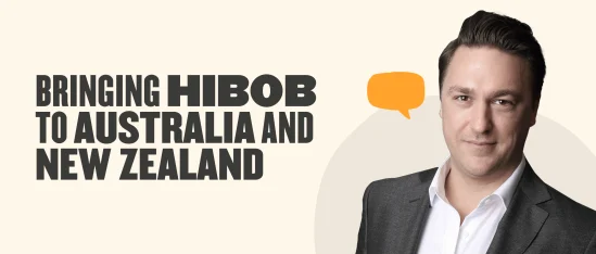 bringing hibob to australia and new zealand, professional man in suit with speech bubble in modern design