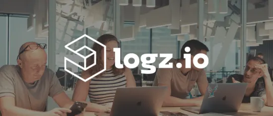 people working together in a modern office, logz.io branding and technology focus during a collaborative session