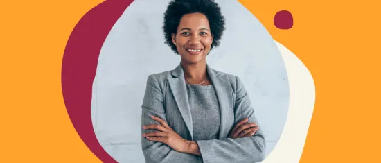 businesswoman in a gray suit posing confidently with crossed arms in front of a colorful abstract background, confident professional woman smiling in a modern office setting