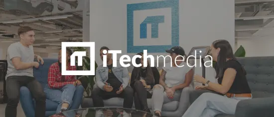 office collaboration, diverse team discussion in modern workspace with iTechmedia logo and vibrant decor