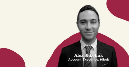 business professional portrait, Hibob Account Executive, casual background, smiling with formal attire and tie