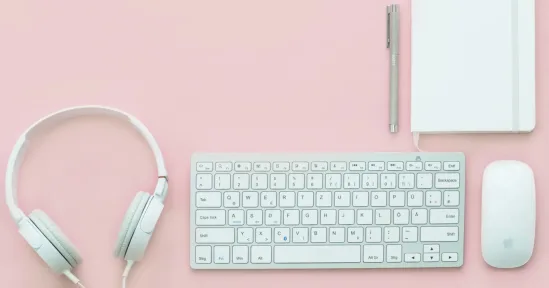 keyboard, headphones, notebook, pen