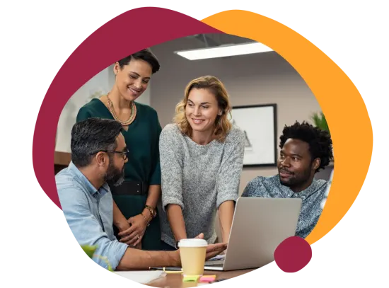 team collaboration, diverse professionals discussing ideas over a laptop in a modern workspace