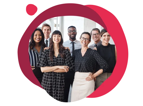 diverse group of professionals smiling together in an office setting with a colorful background, team-building collaboration portrait