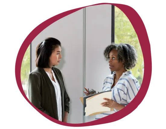 woman discussing ideas, professional conversation in a bright office setting
