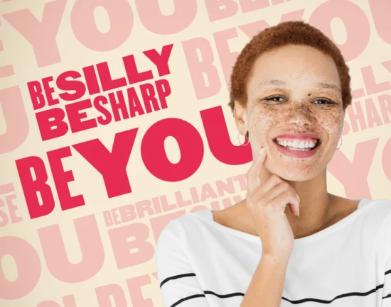 smiling woman with short hair and freckles, wearing a striped shirt, promoting self-acceptance and positivity, colorful background with inspirational phrases