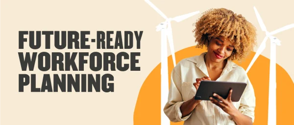 future-ready workforce planning, young woman using tablet with wind turbines in background