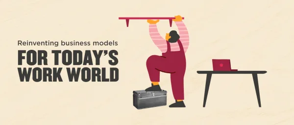 reinventing business models for today's work world, worker using tools near a desk with a laptop and toolbox