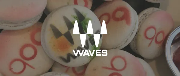 macarons decorated with colorful designs and numbers, featuring the logo 