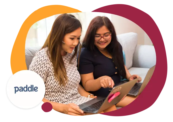 women collaborating, working on laptops together