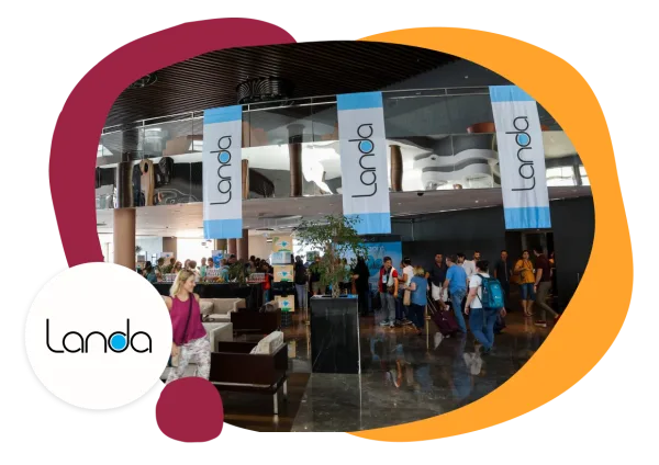 Landa banners in a busy lobby with attendees and modern decor creating a vibrant atmosphere, Landa event registration area