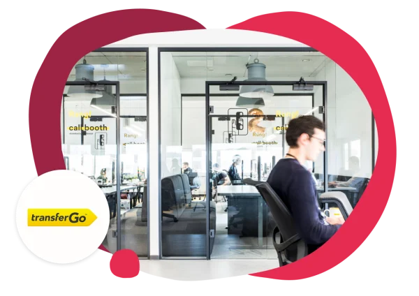 office space with call booths, transferGo logo and branding in a modern workspace design